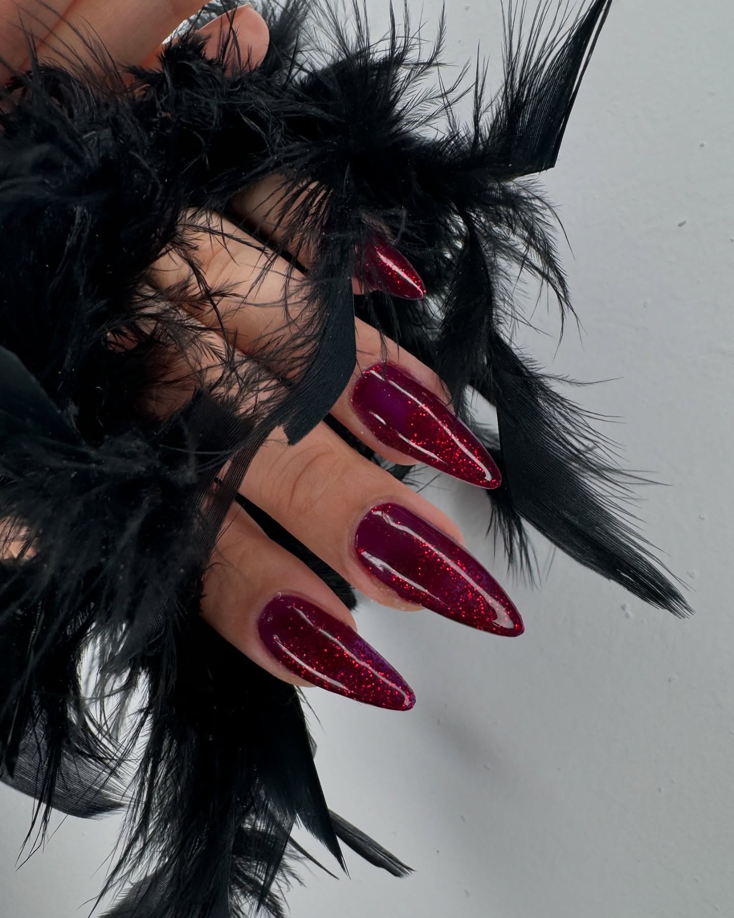 Red glitter stiletto nails — Inzira Atelier